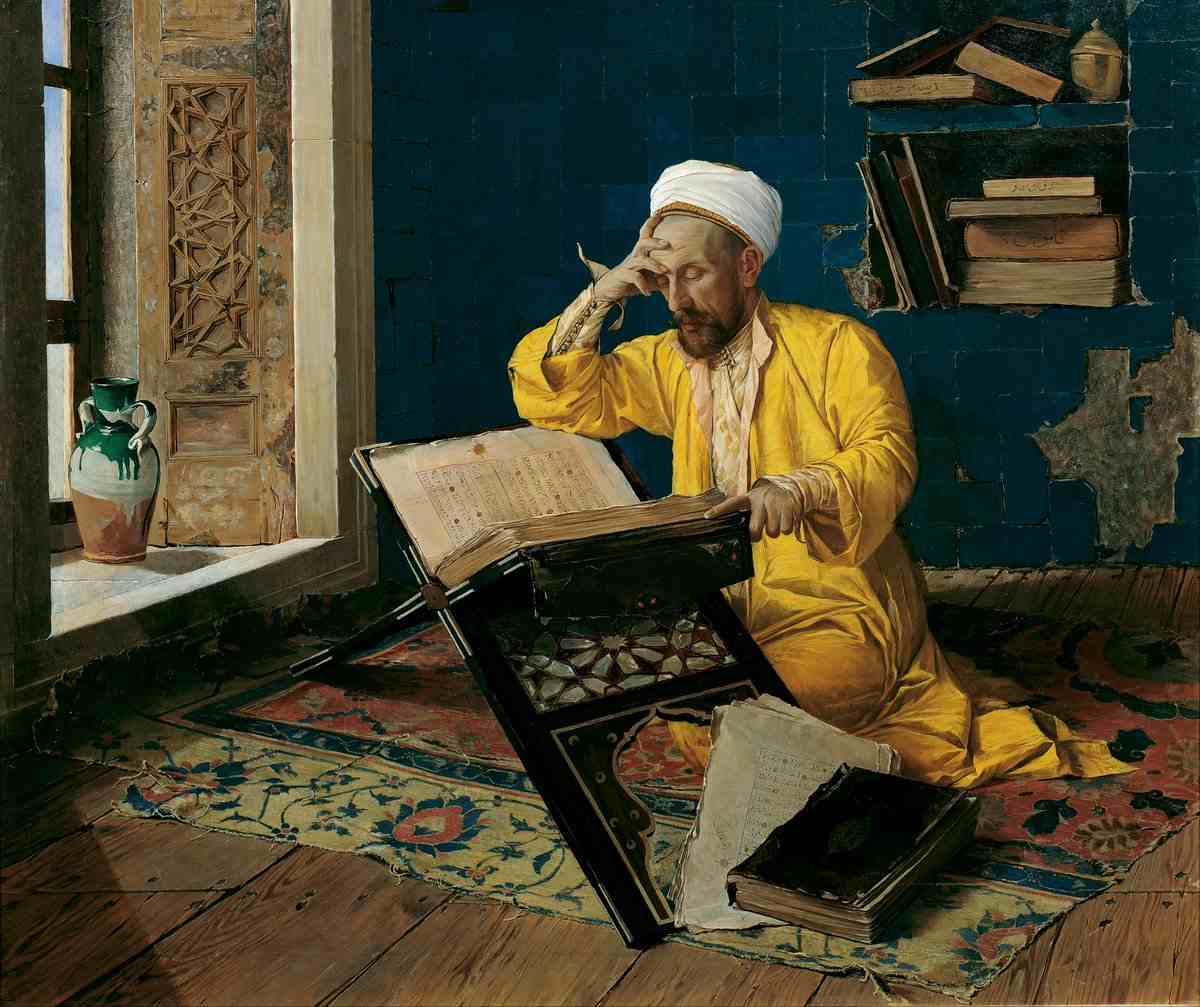 Painting of a scholar in a yellow robe sitting on a carpeted floor poring over a large Quran on a stand, looking very focused